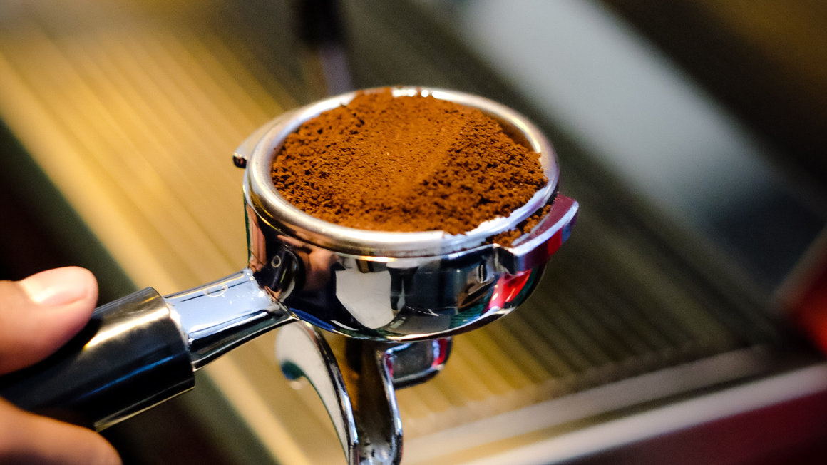 Ground coffee beans in a coffee machine